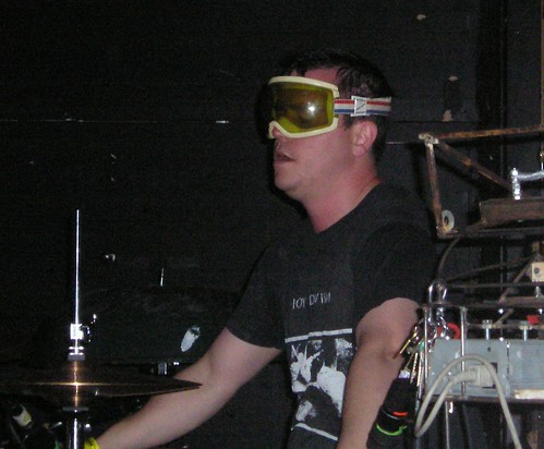 The drummer for Neptune wearing protective ski goggles